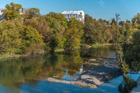 Autumn colors along river in Bana Luka city from Bosnia and Herzegovinaの写真素材