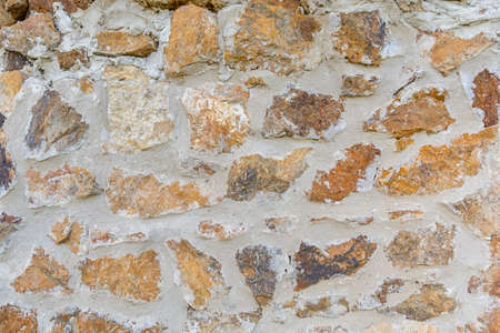 Antique natural stonewall pattern backgroundの写真素材