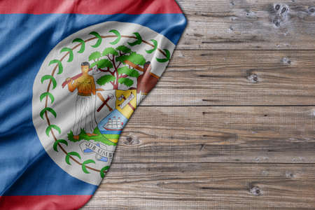Wooden pattern old nature table board with Belize flagの写真素材