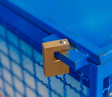 Padlocked on blue iron fridgeの写真素材