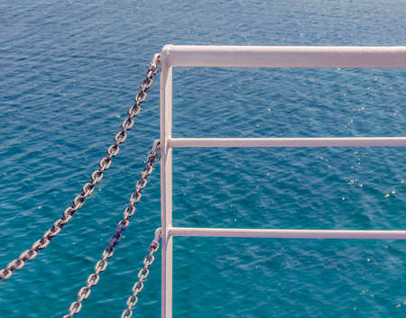 White ferry fence and blue seaの写真素材