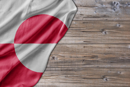 Wooden pattern old nature table board with Greenland flagの写真素材