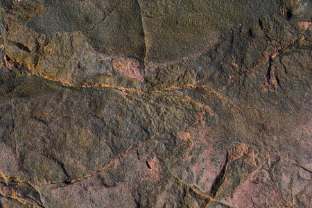 Black, red and yellow texture of sea stone texture