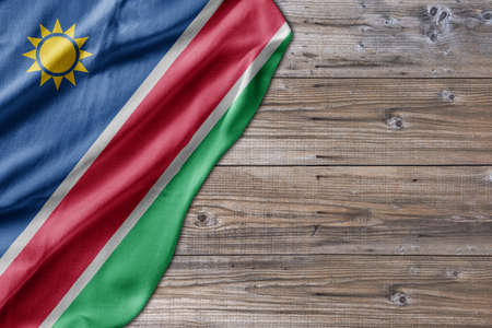 Wooden pattern old nature table board with Namibia flagの写真素材