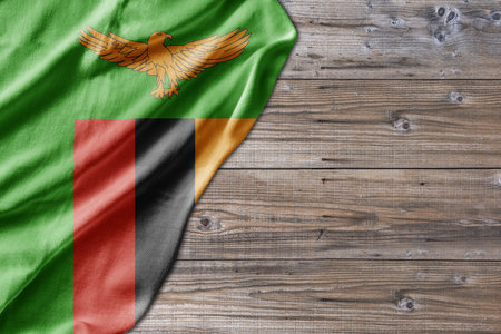 Wooden pattern old nature table board with Zambia flagの写真素材