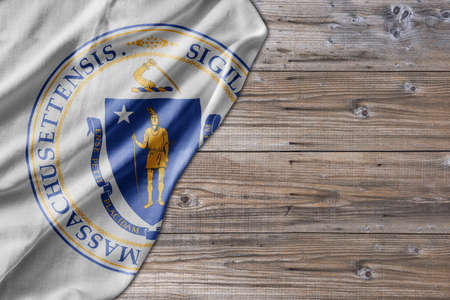 United States country state Massachusetts Seal on old wooden pattern table boardの写真素材