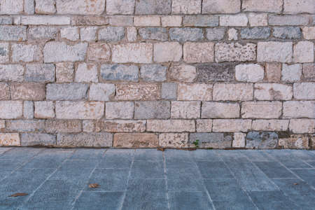 Retro architecture stone wall, background and texture with stone floorの写真素材