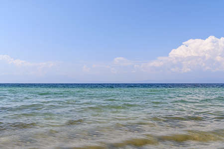Sandy seashore with and clean blue skyの写真素材