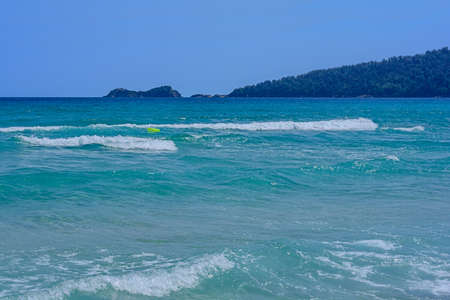 Several beauty sea foamy wave with clear skyの写真素材