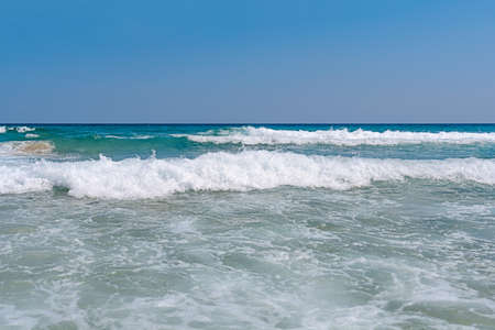 Several beauty sea foamy wave with blue clean skyの写真素材