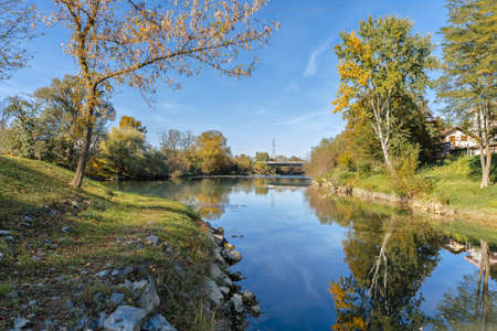 River bridge in the background with tree bushes and clear blue skyの写真素材