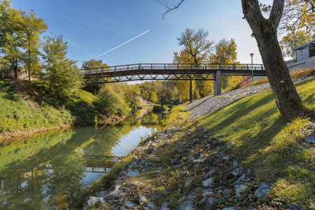 River bridge with tree bushes and clear blue skyの写真素材