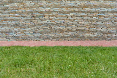 Stone brick wall for place for text, on a sunny dayの写真素材