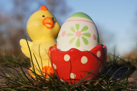 egg holder with a colored egg in the grass