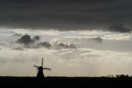 dark clouds over the Dutch landscape.の写真素材