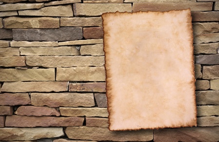 old paper on brick wall の写真素材