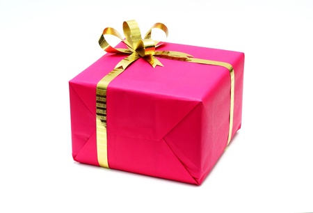 pink present with gold bow and ribbons isolated on white の写真素材
