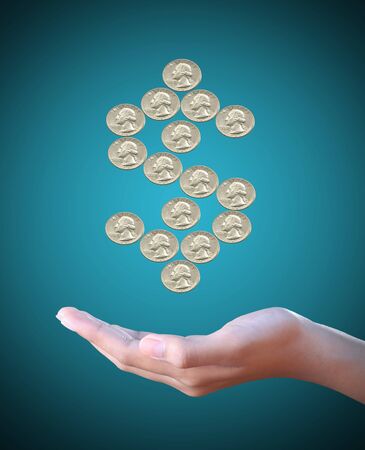 hand holds a dollar coin sign の写真素材