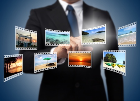 Businessman pushing many image button on the whiteboard  の写真素材