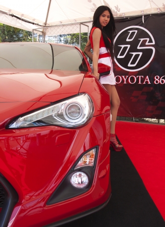 PHUKET, THAILAND - JULY 22  unidentified model with Toyota 86 sport car at Toyota Motorsport 2012  on july 22, 2012 in Phuket Thailandのeditorial素材