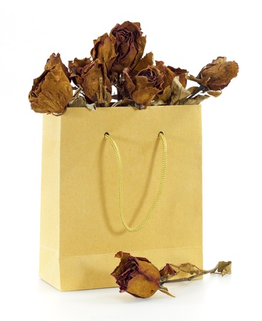 dried roses in a paper bagの写真素材