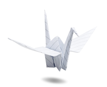 origami paper crane made of white paper with line on white backgroundの写真素材