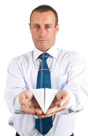 businessman holding a paper airplaneの写真素材