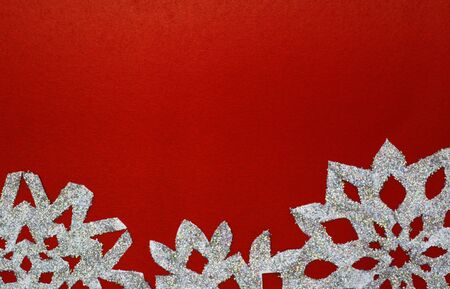 christmas snowflake on red paper cardの写真素材