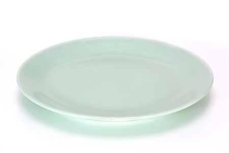 light green plate isolated on white backgroundの写真素材
