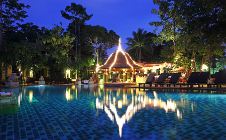 Tropical resort with swimming pool at night のeditorial素材