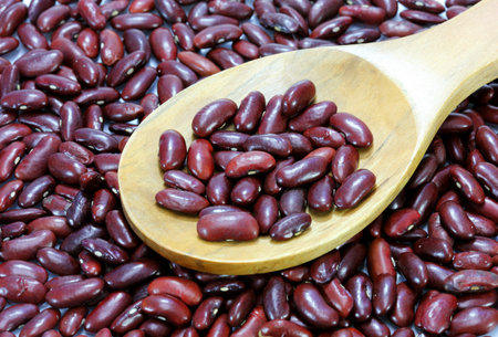 Kidney beans in a wooden cooking spoon 