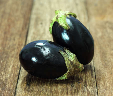 fresh eggplant on wood tableの写真素材