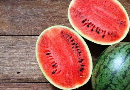 Fresh water melons on wood backgroundの写真素材