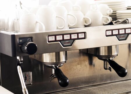 coffee machine and cup in vintage color tonedの写真素材