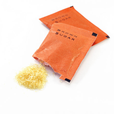 bag of brown sugar on whiteの写真素材