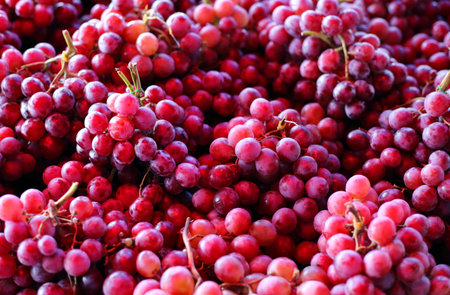 red grapes background in market