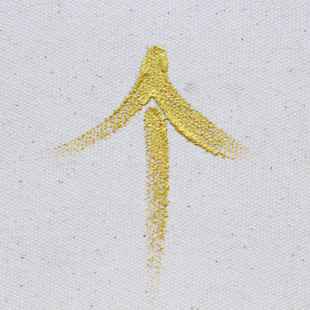 gold arrow painting stroke on canvas background