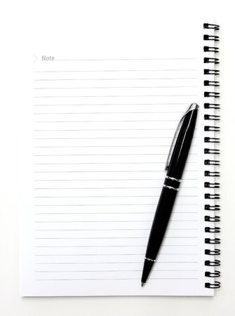 pen over note book on white backgroundの写真素材