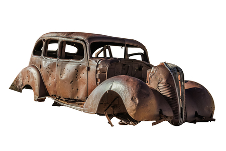 Old Beetle wreck butchered with machine guns. Isolated on white background.の写真素材