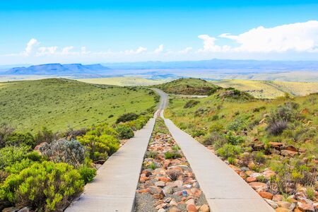 Stone road in the blue sky, Mountain Zebra National Park in summer, Eastern Cape province of South Africa.の写真素材
