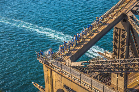 Sydney, Australia - December 29, 2014:Tourists climbing the Bridge. The Sydney Harbour Bridge is one of Australias most well known and photographed landmarks.のeditorial素材