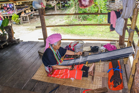 Chiang Rai, Thailand - July 25, 2011: A long neck old woman Karen, Padaung tribe in Chiang Rai town...