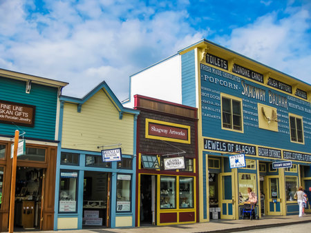 Skagway, Alaska, United States - August 7, 2009: Klondike Gold Rush National Historic Park. Historic buildings are interspersed with new modern buildings. Its streets seem to come from in another age.のeditorial素材