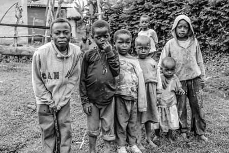 Arusha, Tanzania.- January 2, 2013: Children of Ilkidinga, Waarusha Masai village on the slopes of Mount Meru. Black and white.のeditorial素材