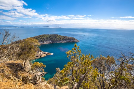 Spectacular views of the cliffs, ocean and Penguin Island during the trek Fluted Cape within the South Bruny National Park Bruny Island, Tasmania Australia.の写真素材