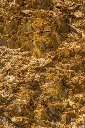 Closeup of textures composed of golden stones.の写真素材