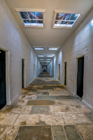 Port Arthur Historic Site, Tasmania, Australia - January 15, 2015: Corridors of the Separate Prison, each of the four wings comprised a central corridor flanked by rows of solitary confinement cells.のeditorial素材