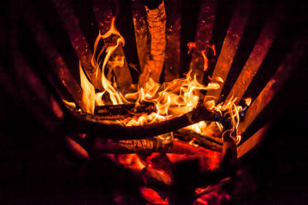 Barbeque BBQ grill with fire in the night.の写真素材