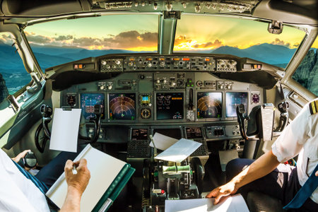 Cockpit and board of an airplane at dawn, with pilots arms and blank white papers for copy space