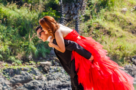 Yanui Beach, Phuket, Thailand - January 1, 2016: Beautiful happy young marriage couple hugging on the Beach during the photo shootingのeditorial素材